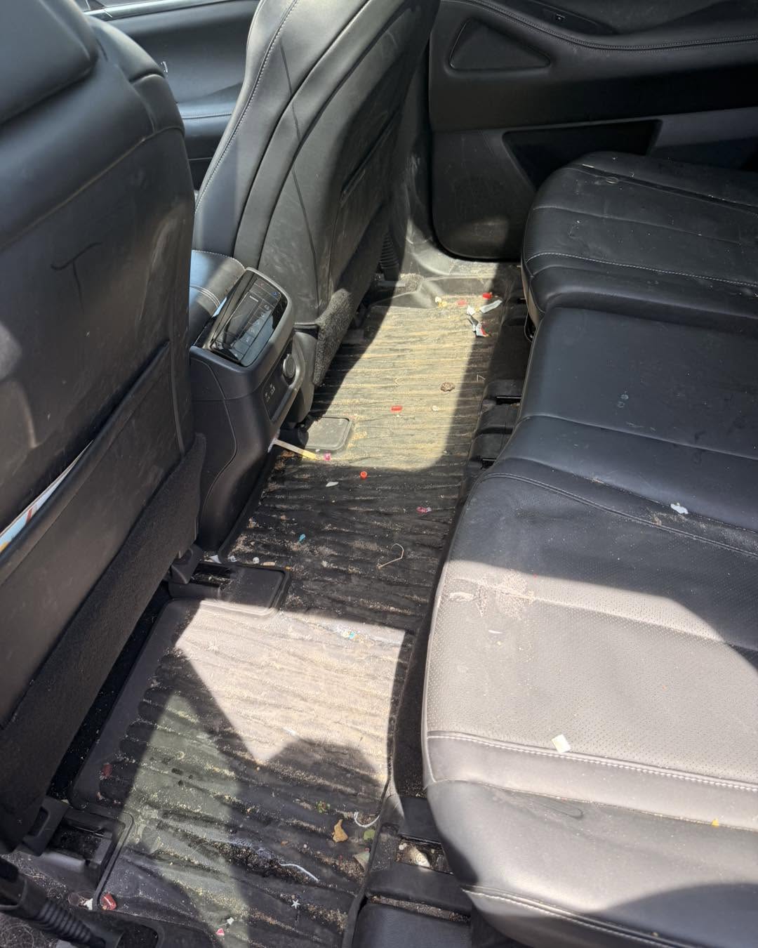 Rear vehicle interior before deep cleaning